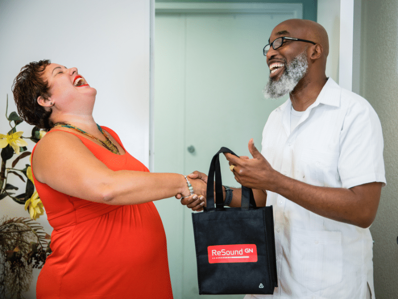 Dr. Michelle and a patient laughing together